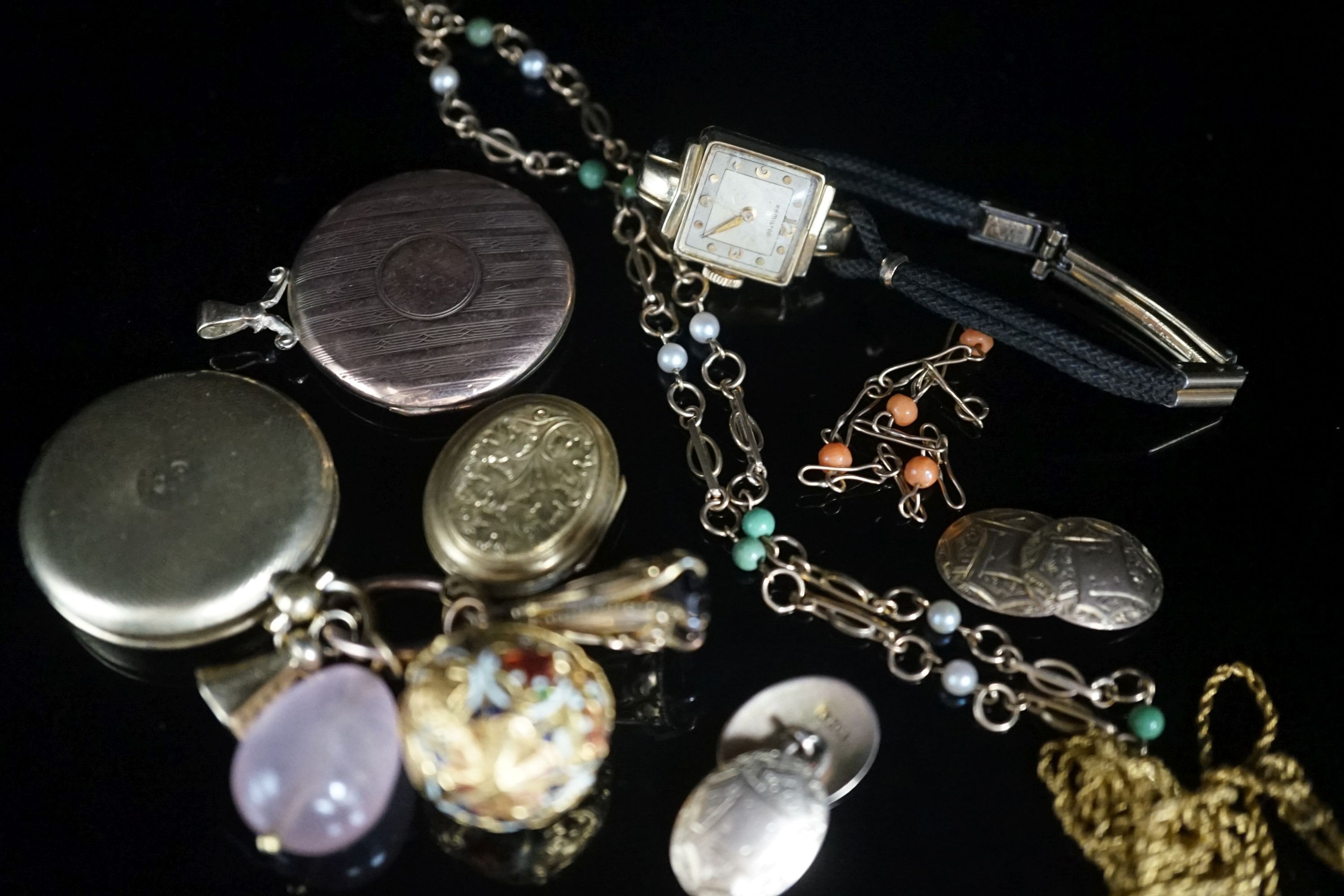 A group of mixed jewellery a pair of 10ct cufflinks, assorted fobs, a 9ct ropetwist chain(a.f.), a 9ct necklace, a 9ct gold small bracelet, wrist watch, locket etc.